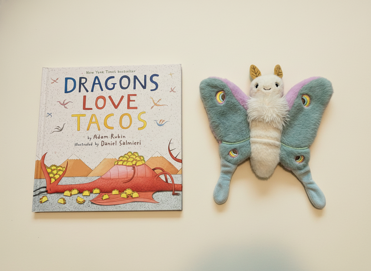 Dragons Love Tacos next to Reference Moth, our resident size guide